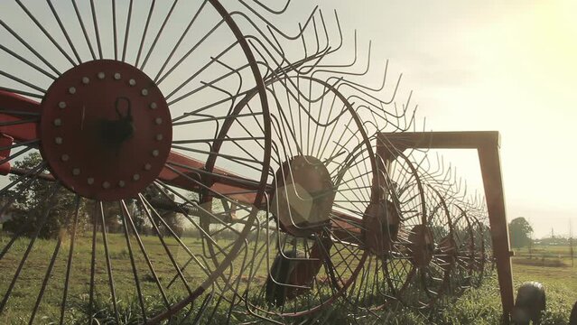 Rural Field with Vintage Hay Rake and Tractor, Golden Hour Countryside Scene, 4K