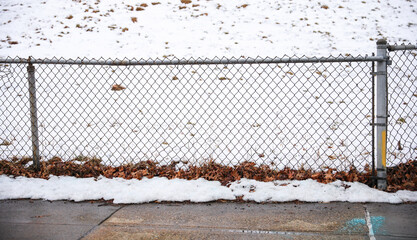 chain fence with blurred background, representing confinement and restriction