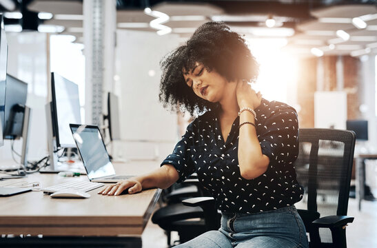 Woman, creative and office with neck pain, burnout and web designer with stress or muscle tension in workplace. Problem, strain and employee massage cramp for wellness, tech and online career