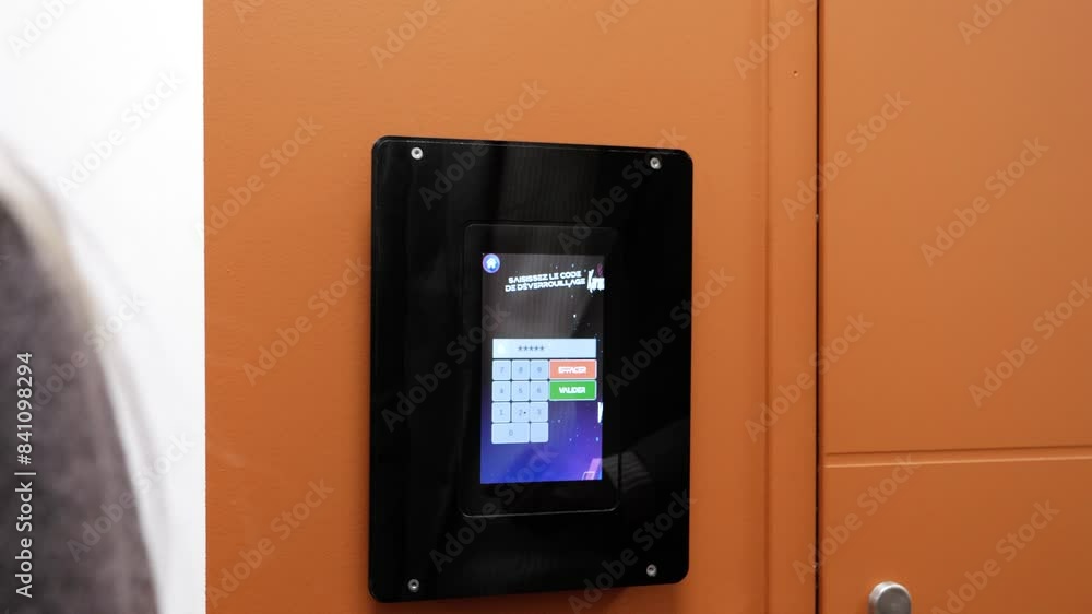 Poster slow motion shot of a man inputting a digital password into a keypad opening a door