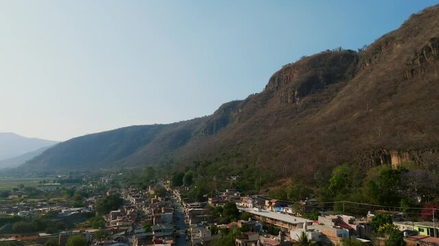 Tamazula de Gordiano, Jalisco, Mexico - A Panoramic Vista of Mountain Foothill Communities - Drone Flying Forward
