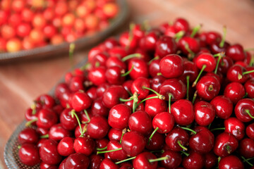 Fresh red cherry fruits in a container