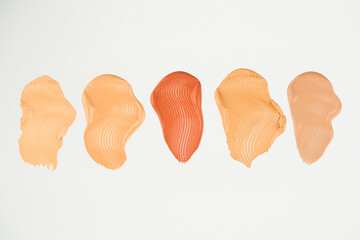 Makeup Liquid foundation smear composition isolated on white background. BB CC Cream Concealer texture.