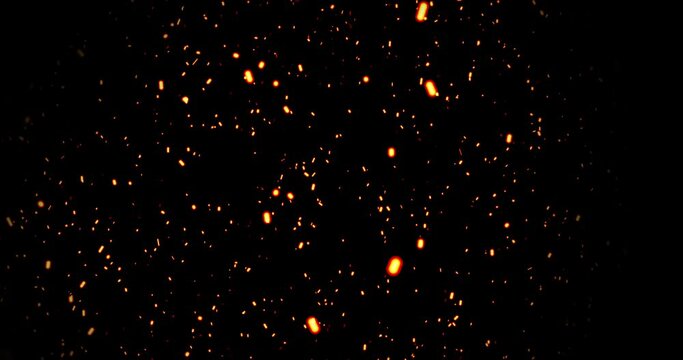Realistic surreal ember fire dust slowing rising up on black bg 4K. Grunge dark fire sparks flying isolated on dark background. Overlay spark tiny flake burning animation. Hell rising burst inferno.