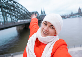 Lively woman tourist enjoying winter city break vacation