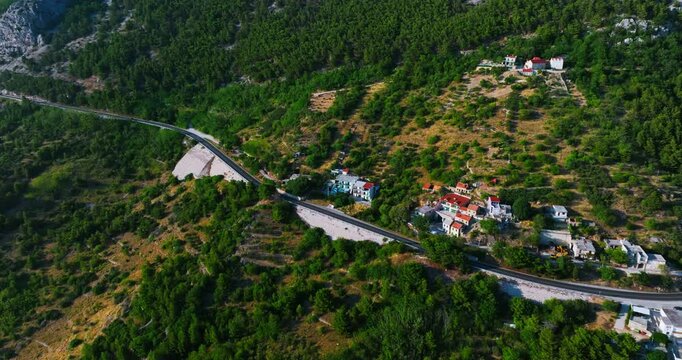 Drone following of the D8 road on the coast of the Makarska riviera in Croatia