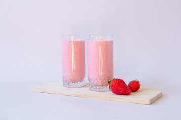Strawberry fresh pink berry smoothie on the table