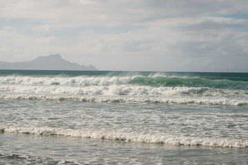 Majestic Waves Crashing on Pristine Beach