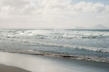 Majestic Waves Crashing on Pristine Beach