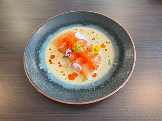Salmon sashimi in cream sauce. Fusion Japanese food. Fusion Salmon sashimi, top view. Salmon lovers