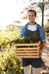 Crate, portrait and smile with man on farm for agribusiness, growth or sustainability. Agriculture, flare and harvest with confident farmer outdoor in field for ecology, grocery market or produce