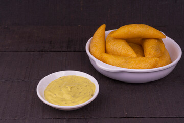 Delicious traditional Colombian empanadas with spicy sauce
