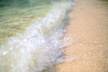  Close up shot of the wave and sand on the beach