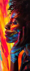 Artistic portrait of a woman with vibrant multicolored paint on her face, creating a stunning blend of colors and emotions.