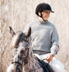 Smile, woman and horse riding in nature for leisure, livestock and adventure outdoors. Happiness,...