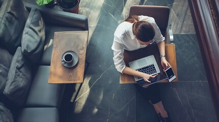 Top view young business woman in white shirt sitting at desk and working online on laptop while using smartphone On table cup of coffeeStudent learning online Girl shopping online chec : Generative AI