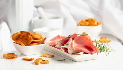 Prosciutto with rosemary and spicy bruschetta crackers.