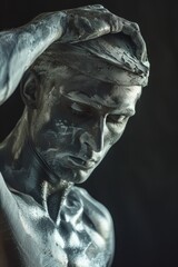 Close up shot of a statue of a man, suitable for use in art, history or cultural contexts