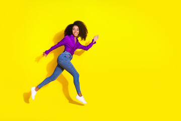 Full body photo of lovely young lady run hurry black friday running dressed stylish violet garment isolated on yellow color background