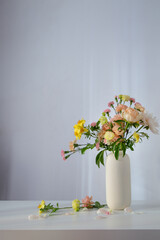 beautiful bouquet in white vase in sunlight