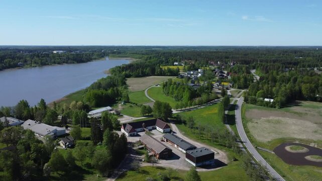 Low flyover of Lake Tuusula farmhouse in vibrant Finland near Kerava