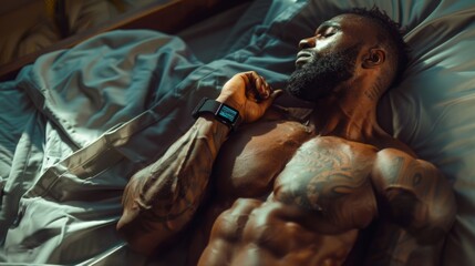 A muscular Black man with a beard and tattoos sleeps in bed, wearing a smartwatch.