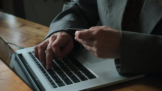 Paying online. Woman finalizing internet orders with bank card payment. 
