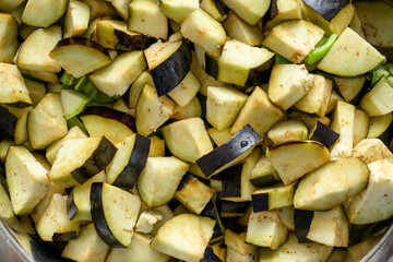 Top view of eggplants being diced for frying
