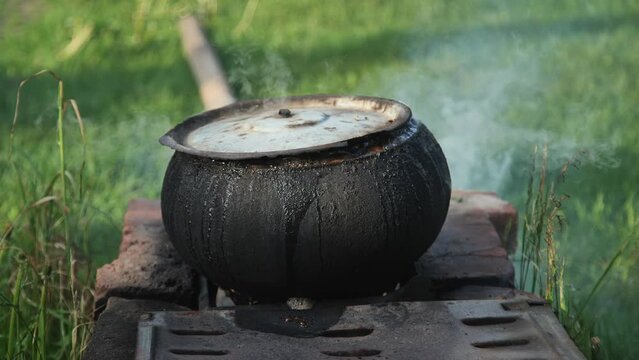 The cast iron in the village is used to cook food for the livestock.