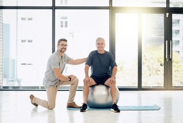 Portrait, physiotherapist and old man with gym ball, smile and happy rehabilitation in senior care. Physio, consultant and elderly patient for mobility training, exercise and help in retirement.
