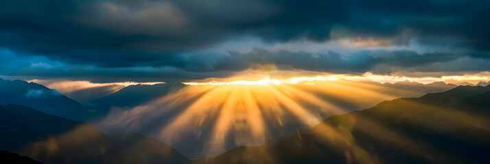 panoramic view of the sun setting over mountains in new zealand. olden light shining through clouds 