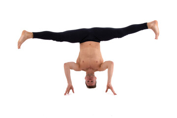 Fitness and Yoga. Healthy lifestyle. Young attractive man posing in the studio. White background.