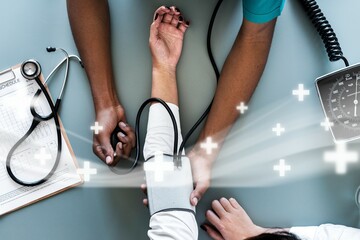 Nurse measuring patient blood pressure remix