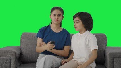 Indian siblings fighting for TV remote Green screen - Powered by Adobe