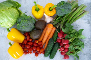 Healthy eating. Agriculture. Summer vegetables on the table on a gray background. View from above . Close-up