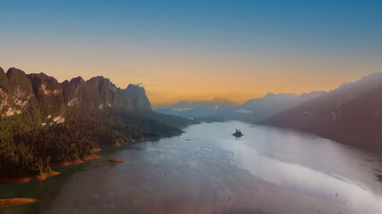 Sunset scene in Khao Sok national park Cheow Lan Dam lake with blue sky background in Surat Thani, Thailand