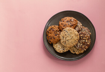 homemade cookies on plate  on pink background