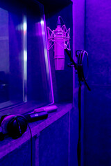 the recording room is dark with neon lighting in a soundproof room for recording songs or...