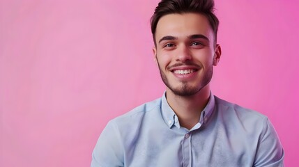 Obraz premium Friendly and Confident Professional in Casual Business Attire Smiles Against Vibrant Background