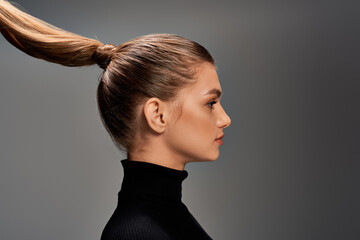 A young, beautiful woman is depicted with her long hair styled into a ponytail, exuding elegance...