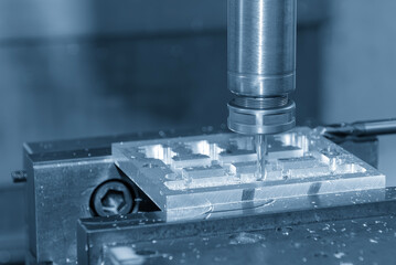 The CNC milling machine cutting  aluminum part by solid flat end mill tool.
