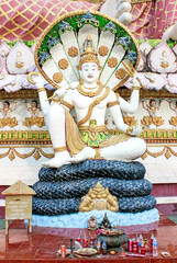Sacred Statue of Serpent God Naga Displayed at Temple with Intricate Multicolored Decorations