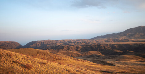 Autumn landscape of vast plains in China. Breathtaking, amazing, endless desert mountain landscapes bordering the Gobi Desert.