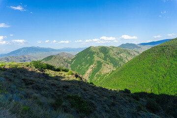 Naklejka premium Mountain landscape and Caucasus ridge covered with clouds