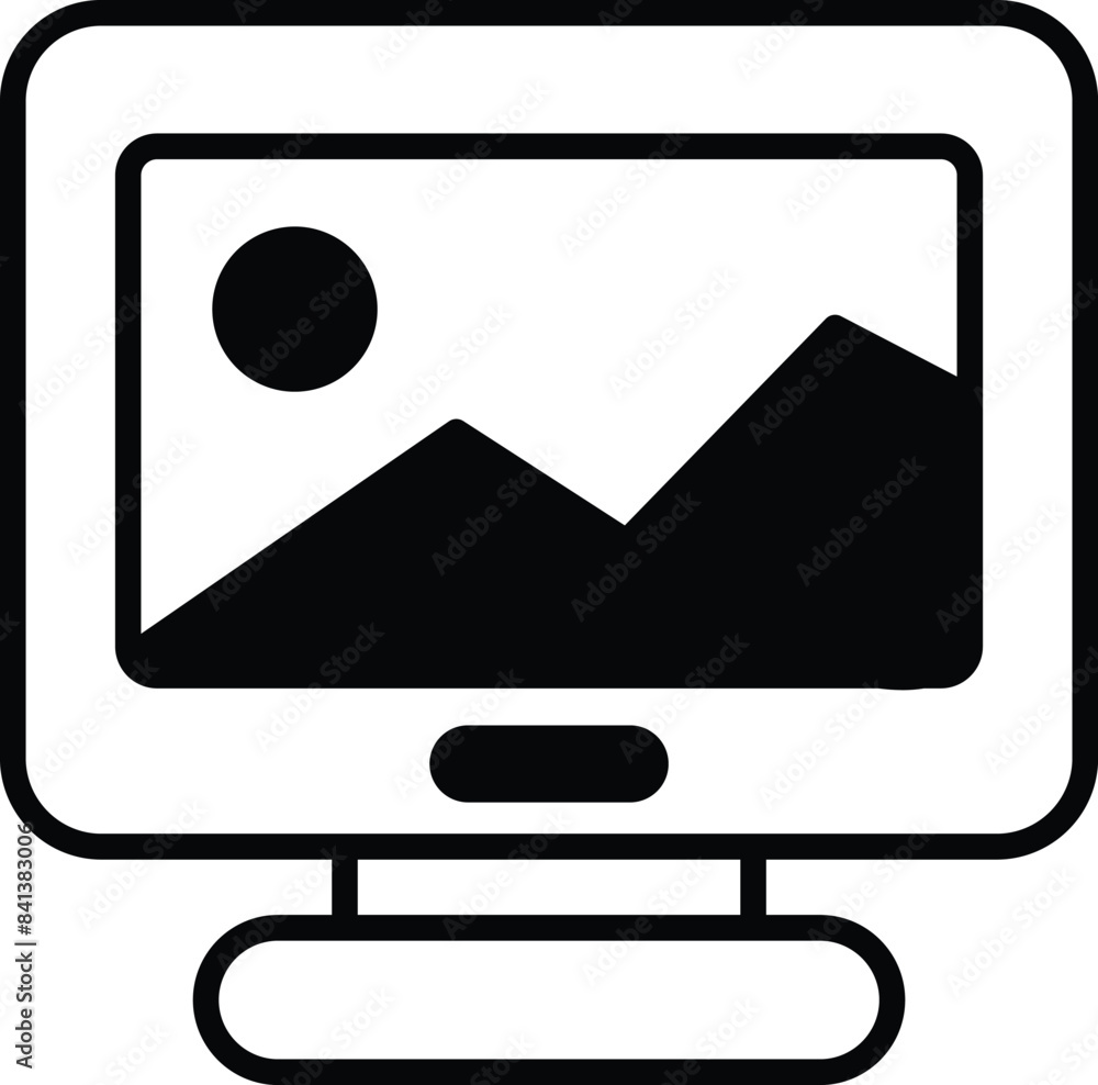 Poster a computer monitor with a picture of mountains on it