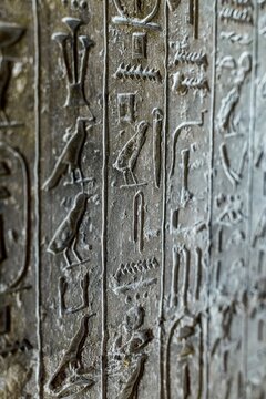 Intricate hieroglyphs on interior wall of Khufu Pyramid, ancient inscriptions