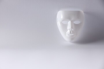 Plastic face mask on white background, space for text. Theatrical performance