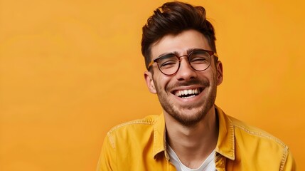 Fototapeta premium Smiling Young Professional Manager with Glasses on Vibrant Orange Background