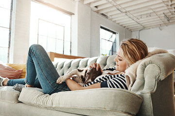 Dog, sofa or happy woman in home to relax on living room couch in house, lounge or apartment....