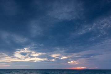 stunning clouds float above the sea as the sun sets..scenery The beauty of the sky was mesmerizing in stunning sunset.Gradient color..Sky texture, abstract nature background..